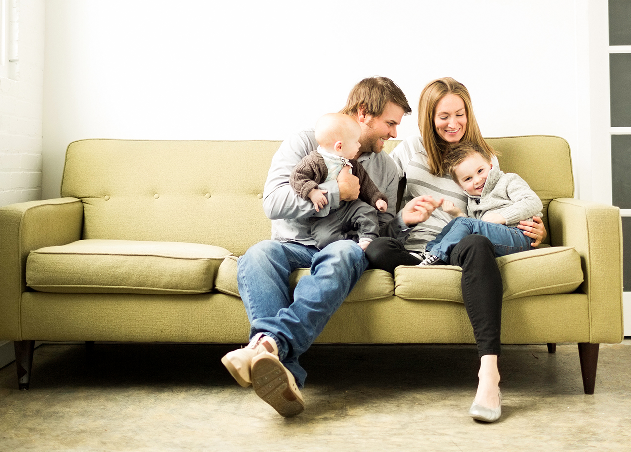 Family of four on a couch