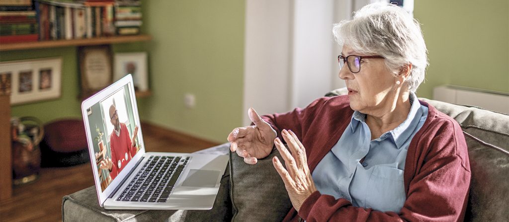 Older woman on a video call on a laptop